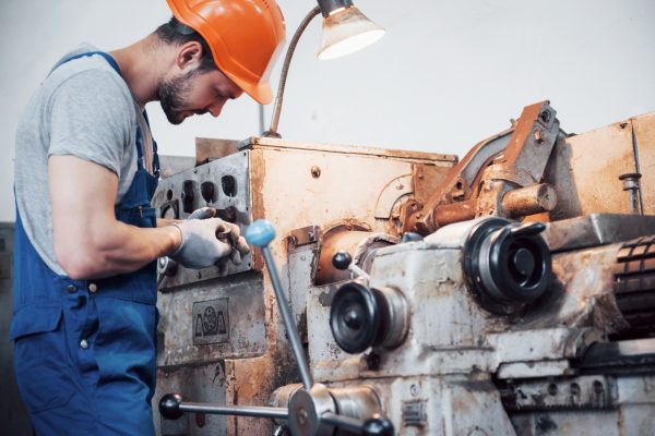 portrait-young-worker-hard-hat-large-metalworking-plant